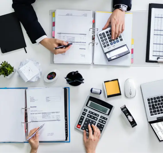 Two Accountants managing invoices for a Small Business Tax Preparation, Bookkeeping and Accounting Services in Billings MT
